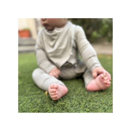 Sahe magnetic baby bamboo bibs - lifestyle baby with sage onesie birdie front side