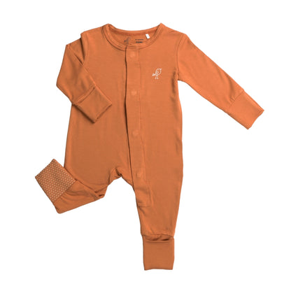 Front view of Birdie bamboo terracotta orange magnetic baby sleepsuit with convertible feet and mittens